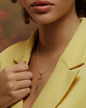 The 14K Solid Gold Unique Statement Chain Drop Necklace from the Harmony Collection is crafted from real solid yellow gold and features a rectangular open pendant with two vertical hanging bars on a delicate chain, available in multiple chain size options.