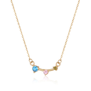 Introducing the 14K Solid Gold Ocaliptus Flower Necklace from the Chloris Collection, featuring a delicate, hypoallergenic chain adorned with three gemstones in blue, pink, and green set on a curved bar at its centerpiece.