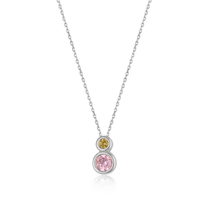 The 14K Solid Gold Mimoza Flower Necklace from the Chloris Collection showcases a sophisticated design with two round gemstones: a smaller yellow stone set above a larger pink one. The custom chain length enhances its minimalist pendant style, offering a hypoallergenic touch ideal for those with sensitive skin.