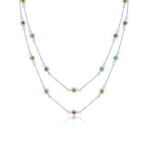 Discover the elegance of the 14K Solid Gold The Beginning Station Chain Necklace from the Chloris Collection. This exquisite piece features two rows of delicate chain links, embellished with evenly spaced, hypoallergenic lab-grown gemstones in pink, blue, and green. The vibrant colors of these stones enhance both beauty and comfort in this sophisticated design.