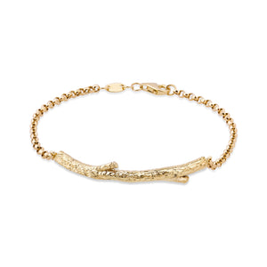 The 14K Solid Gold Tree Branch Bracelet from the Into the Woods Collection by Erdem Akan showcases a textured twig-like centerpiece available in yellow, white, or rose gold. Its hypoallergenic design is elegantly attached to a delicate chain with a secure clasp closure.