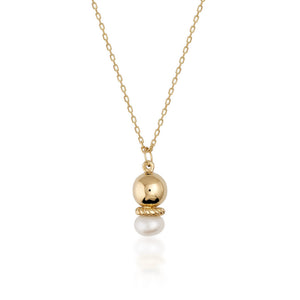 Introducing the 14K Solid Gold Natural Pearl Necklace from the Elegance Collection, featuring a delicate 14K solid yellow gold chain. This exquisite piece showcases a pendant with a polished gold sphere and natural pearl, separated by a textured gold ring. The hypoallergenic design offers both elegance and minimalism.