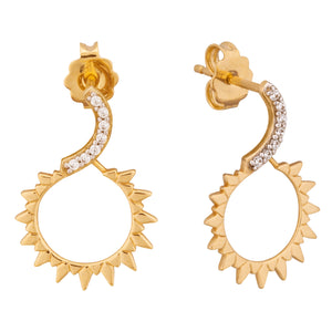 The 14K Solid Gold The Sun Crown Earrings, part of the Helios Collection, showcase a unique design with a wavy top adorned with small lab-grown diamonds. Crafted from real solid gold, these earrings elegantly transition into an open circular shape featuring sun-like points around the edges. They are hypoallergenic and feature a shiny finish with a secure post-back closure.