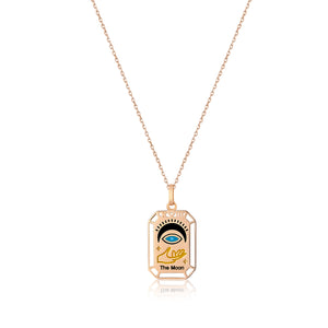 The Moon - 14K Solid Gold Tarot Necklace from the Tarot Collection features a beautifully crafted tarot pendant made of solid yellow gold. It includes an intricate illustration of an eye above a hand, with the text "The Moon." The rectangular design is enhanced by decorative edges and small star shapes for added elegance and hypoallergenic comfort.