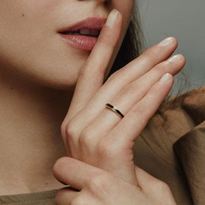 Presenting the 14K Solid Gold Black Enamel Horizon to Moon Ring from the Moonlight Collection, a sleek piece featuring a thin black stripe along its outer edge, set against a plain white background that highlights Runda's exceptional handcrafting expertise.