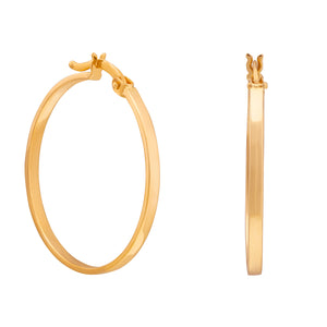 The 14K Gold Round Hoop Earrings from the Harmony Collection by RundaJewelryUs are showcased. One earring is pictured facing forward, accentuating its circular form, while the other is displayed from the side, highlighting its sleek profile and contemporary design.