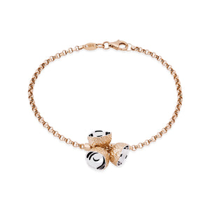 Discover the 14K Solid Gold Acorn Bracelet from the Into the Woods Collection by Erdem Akan, featuring a chain link design with three small conical charms at its center. Each charm is adorned with an abstract design atop a circular gold disc. This hypoallergenic bracelet ensures secure fastening with its lobster claw clasp. Model No B22DK1033.