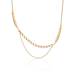 The 14K Solid Gold Succulent Necklace from the Into the Woods Collection by Erdem Akan is a sustainable jewelry piece featuring an asymmetrical design in yellow gold. It combines two distinct chain types: one with flat, leaf-like links and another with smaller, rounded links. Its delicate and elegant appearance makes it an ideal hypoallergenic jewelry choice.