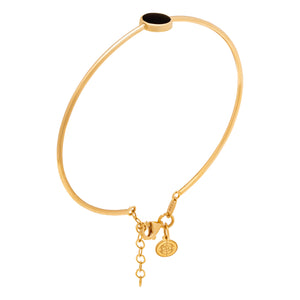 Introducing the 14K Solid Gold The Moon Effect Bangle Bracelet from the Moonlight Collection—a chic design accented with a minimalist round black feature and complemented by a delicately crafted dangling charm, attached by an adjustable short chain.