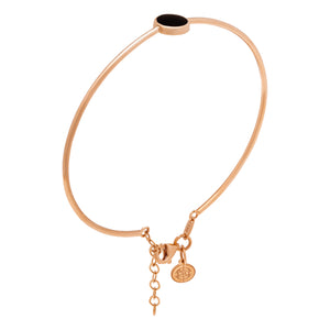 Introducing the 14K Solid Gold The Moon Effect Bangle Bracelet from the Moonlight Collection—a chic design accented with a minimalist round black feature and complemented by a delicately crafted dangling charm, attached by an adjustable short chain.