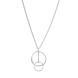 This necklace from the Harmony Collection is designed with sustainable methods and features a delicate chain adorned with two interlocking circles. Crafted from 14K real solid yellow gold, the larger circle gracefully joins a smaller one, creating a simple and elegant design against a plain white background.