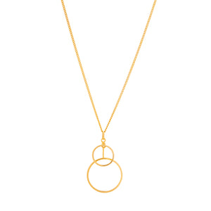 The 14K Solid Gold Geometric Intertwined Round Circles Necklace from the Harmony Collection showcases two elegantly linked circular pendants, delicately suspended from a fine chain and meticulously handcrafted using sustainable methods.