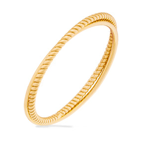 A 14K solid gold spiral twist rope ring from the Harmony Collection is isolated on a white background, showcasing Runda's fine handcrafting and its unique, minimal style.