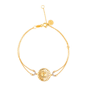 Introducing the 14K Solid Gold Sun Bracelet from the Helios Collection. This exquisite piece features a radiant sunburst design centered around a circular medallion adorned with etched sun rays. Crafted from 14K solid gold, this bracelet offers a delicate chain with an adjustable clasp and a small circular tag. Ideal for sensitive skin, it is hypoallergenic to ensure maximum comfort.