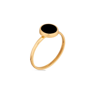 The 14K Solid Gold The Full Moon Black Enamel Ring from the Moonlight Collection features a round black stone setting on a white background. This flat and smooth stone offers a minimalist and elegant design.