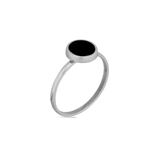 The 14K Solid Gold The Full Moon Black Enamel Ring from the Moonlight Collection features a round black stone setting on a white background. This flat and smooth stone offers a minimalist and elegant design.