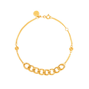 The 14K Solid Gold Bracelet from the Harmony Collection elegantly combines curb link designs with delicate smaller links on each side. Crafted in hypoallergenic 14K solid gold, it features a circular clasp and a round charm engraved with a symbol, available in your choice of yellow, white, or rose gold.