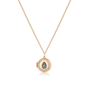 Here's a revised version of the sentence using the provided product data:

The 14K Solid Gold Drop Custom Photo Locket Medallion Necklace from the Timeless Collection features a round pendant with a teardrop design adorned with pink gemstones. Made from hypoallergenic solid yellow gold, it hangs on a simple link chain available in multiple size options.