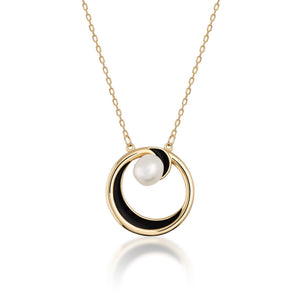 The necklace from the Elegance Collection is made of 14K solid yellow gold and features a circular pendant with a black accent and a natural pearl at its center. The hypoallergenic chain is delicate and enhances the elegant design of the pendant.