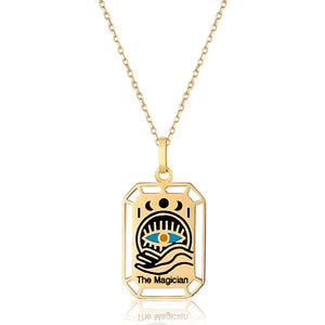 The Magician - 14K Solid Gold Tarot Necklace from the Tarot Collection is a pendant in real yellow gold featuring an engraved tarot card design named "The Magician." It showcases a hand holding a blue eye with celestial symbols, including the sun and moon phases, all connected to a delicate, hypoallergenic gold chain.