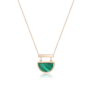 The 14K Solid Gold Genuine Natural Malachite Necklace from the Endless Collection features a hypoallergenic design with a semi-circular green malachite pendant, complemented by a gold bar at the top, all crafted from 14K real solid yellow gold. The natural malachite gemstone is suspended from a delicate chain and showcases its signature swirling patterns.