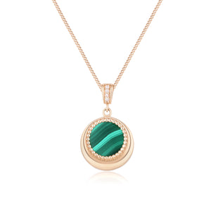 Introducing the 14K Solid Gold Diamond & Malachite Pendant Necklace from our Endless Collection, featuring a circular pendant with a natural malachite gemstone surrounded by small gold beads. This exquisite pendant, crafted from 14K real solid yellow gold, is delicately attached to a fine gold chain and adorned with sparkling crystal accents above.