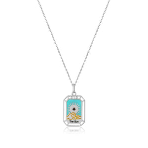 The Sun - 14K Solid Gold Tarot Necklace from the Tarot Collection highlights a tarot card design of The Sun, featuring a stylized sun with rays and clouds set against a turquoise backdrop. This hypoallergenic pendant elegantly hangs from a delicate gold chain.