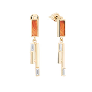 A pair of earrings from the Achates Collection made of 14K solid gold, showcasing rectangular orange agate or carnelian gemstones at the top, accented with hexagonal gold designs and small rectangular clear gemstones below.