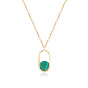 Introducing the Endless Collection's 14K Solid Gold Minimal Malachite Pendant Necklace: a stunning piece featuring a chain and an oval-shaped pendant crafted from genuine solid yellow gold. The natural malachite gemstone elegantly fills the lower half, while its minimalist design radiates against a white backdrop, providing both beauty and hypoallergenic comfort.