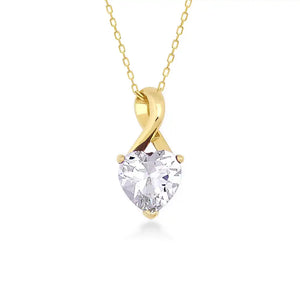 The 14K Solid Gold Cubic Zirconia Solitaire Necklace showcases a heart-shaped design with a stunning cubic zirconia gemstone, elegantly suspended from a delicate chain against a white background.