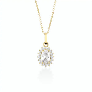 The 14K Gold Oval Cubic Zirconia Gemstone Necklace showcases a delicate design with an oval-shaped pendant adorned with a prominent cubic zirconia gemstone. Smaller stones encircle the centerpiece, creating a dazzling effect against a simple white backdrop.