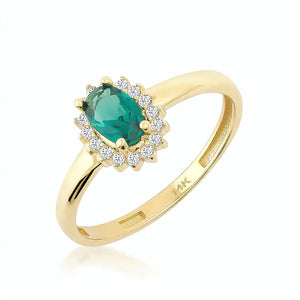 This 14K solid gold ring, named the Emerald May Birthstone Ring, features an oval green gemstone surrounded by dazzling diamonds, capturing a vintage aesthetic. The hallmark is gracefully engraved inside its smooth band.