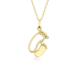 This exquisite piece, the 14K Solid Gold New Baby Feet Necklace by RundaJewelryUs, showcases a pendant in the shape of two baby footprints. It's an ideal choice for new moms, with one footprint featuring a small diamond. The pendant elegantly dangles from a delicate chain.