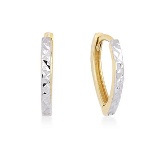 A pair of 14k Solid Gold Small Hoops showcases a distinctive two-tone design. One half features smooth gold, while the other half is adorned with textured silver and a geometric pattern reminiscent of diamond cut earrings. These striking earrings are elegantly displayed against a plain white background.