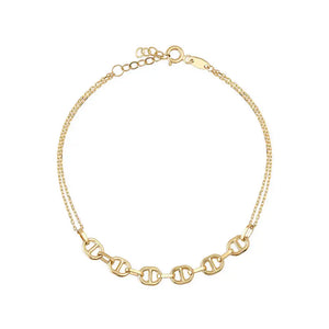 Introducing the 14K Gold Flat Mariner Anchor Chain Bracelet! Featuring intricate decorative links, this piece boasts a centerpiece of elegant interlocking oval shapes. The small clasp includes an adjustable chain for a customizable fit, making it an ideal choice for stylish layering.