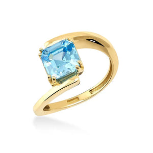 This 14K Solid Gold Aquamarine March Birthstone Solitaire Ring features an exquisite, square-cut aquamarine gemstone set in a prong setting. With its sparkling light blue hue and distinctive asymmetrical band design, this ring offers both elegance and uniqueness.