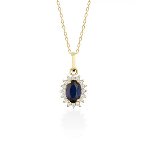 The 14K Gold Sapphire Necklace by RundaJewelryUs features a minimalist design, highlighted by an oval-shaped blue gemstone pendant surrounded by small white gemstones in a halo setting.