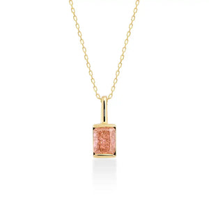 The 14K Gold Pink Rose Quartz Necklace features a rectangular pink rose quartz pendant on a delicate 14K solid gold chain, symbolizing self-love, and is showcased against a white background.