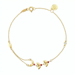 Introducing the 14K Solid Gold Ruby Butterfly Bracelet from the Chloris Collection, featuring a delicate chain design with small red beads and leaf-shaped charms. This exquisite bracelet is embellished with butterfly accents, making it an ideal choice for those celebrating a July birthstone.