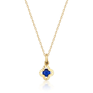 The 14K Solid Gold Clover Sapphire Necklace boasts a refined design with a delicate gold chain and an elegant pendant. The four-leaf clover-shaped pendant is adorned with a striking deep blue sapphire at its center, making it an excellent choice for those born in September.