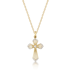 The 14K Solid Gold Tiny Cross Pendant Necklace features exquisite detailing and a central diamond-like stone, blending gold and silver tones for a captivating design. Ideal for religious occasions, it is elegantly showcased against a plain white background, exuding timeless sophistication.