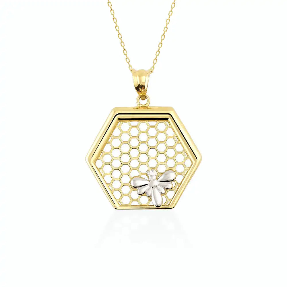 The 14K Gold Queen Bee Pendant Necklace by RundaJewelryUs features a stunning hexagonal honeycomb pendant, beautifully embellished with a delicate bee design, and gracefully suspended on a fine chain.