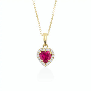 The 14K Gold Heart Ruby Necklace showcases a delicate gold chain paired with a captivating ruby heart pendant, embellished with smaller white stones that enhance its sparkle. This elegant and lightweight necklace is a beautiful accessory designed for women.