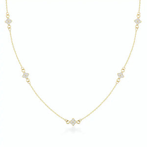 A refined 14K gold necklace adorned with evenly spaced, small flower-shaped diamond pendants along the chain, elegantly showcased on a white background.