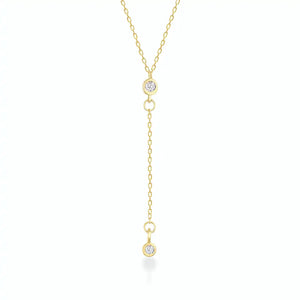 Introducing the 14K Gold Y Minimal Diamond Chain Necklace by RundaJewelryUs, a delicate piece showcasing two small round diamond pendants elegantly spaced along the chain. One pendant drapes lower for a sophisticated layered look against a plain white background.