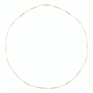 The 14K Gold Station Minimal Chain Necklace features small, evenly spaced bar links arranged in a circular shape against a plain white background, making it ideal for layering or wearing alone as a standout solid gold chain piece.