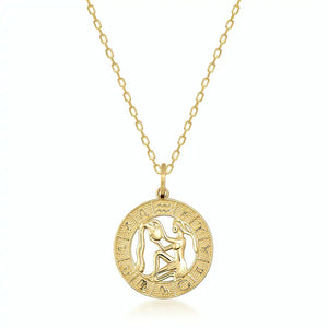 The 14K Gold Astrology Zodiac Charm Necklace by Runda Jewelry features a solid gold chain and a circular pendant adorned with an astrology zodiac symbol. The intricate detailing along the edge adds elegance to this charming necklace, set against a plain white background.