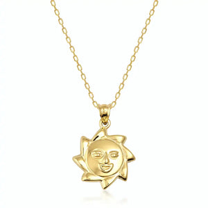 This exquisite piece from RundaJewelryUs is the 14K Gold Sun Necklace, showcasing a pendant with a cheerful face at its core and encircled by radiant pointed rays.