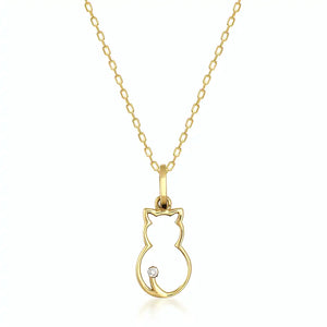 Discover the 14K Solid Gold Cat Necklace, a must-have for cat enthusiasts and summer jewelry collections. Its elegant chain displays a cat outline pendant adorned with a small gemstone at the tip of the tail, all set against a white background.