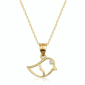 The 14K Solid Gold Bird Necklace, featuring a diamond eye, glistens on its delicate chain against a white background, showcasing the elegance of fine gold jewelry.